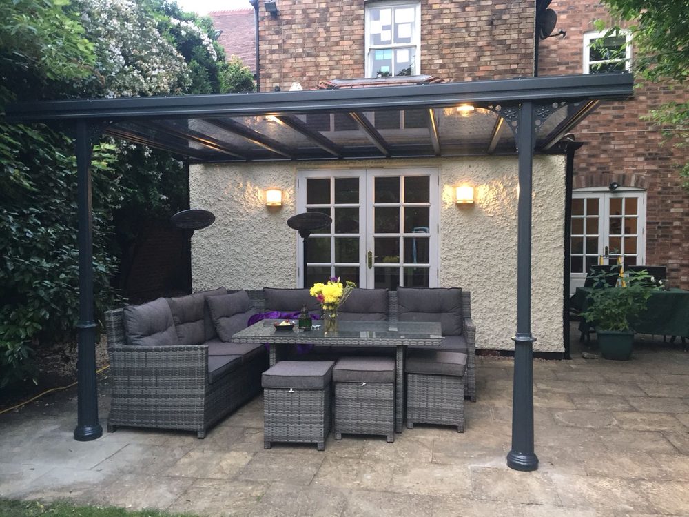 Veranda sheltering an outdoor sofa and dining set