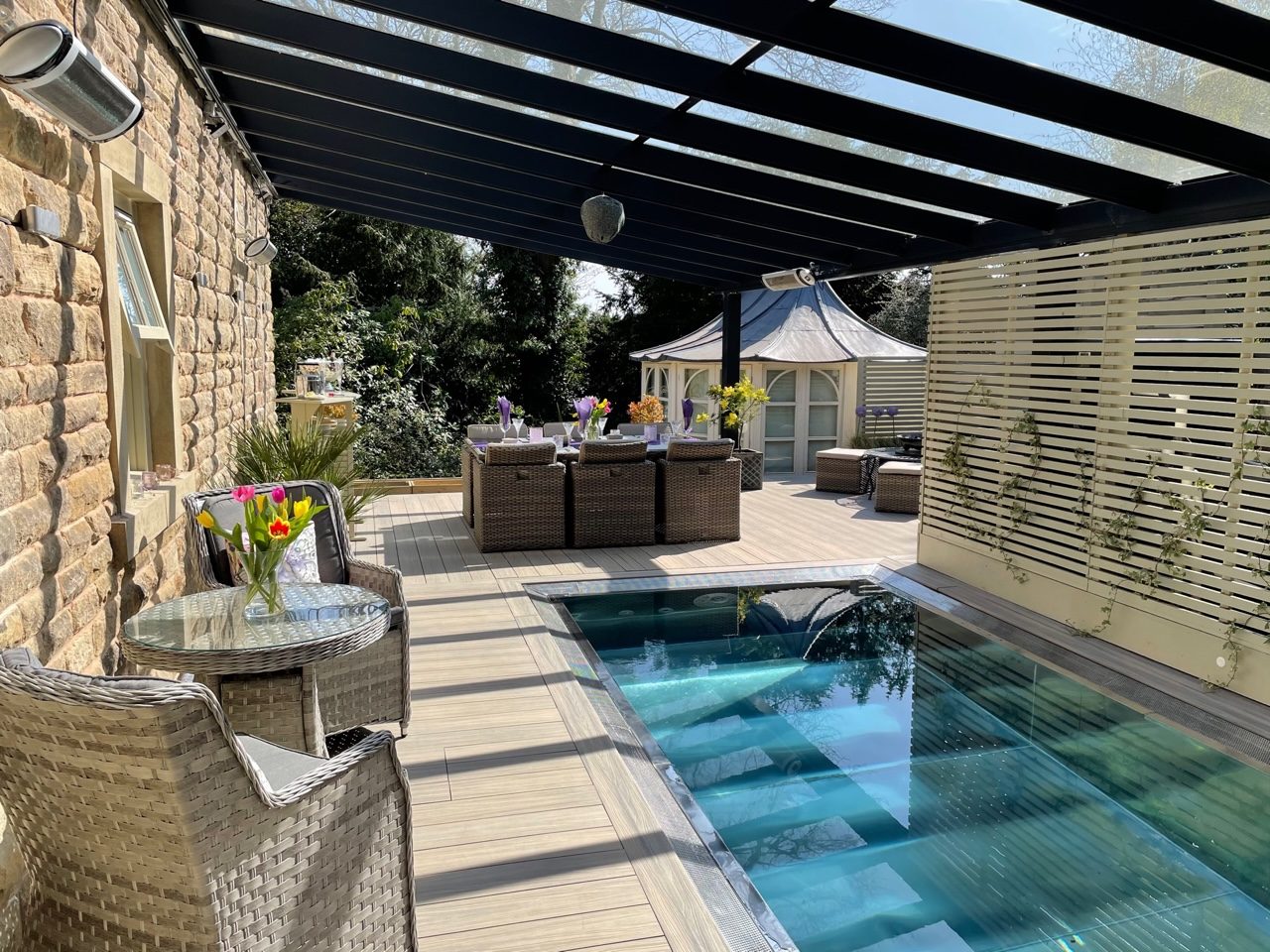 Contemporary aluminium veranda over a poolside deck