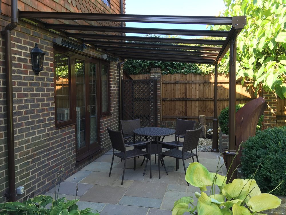 Veranda over a paved patio dining area