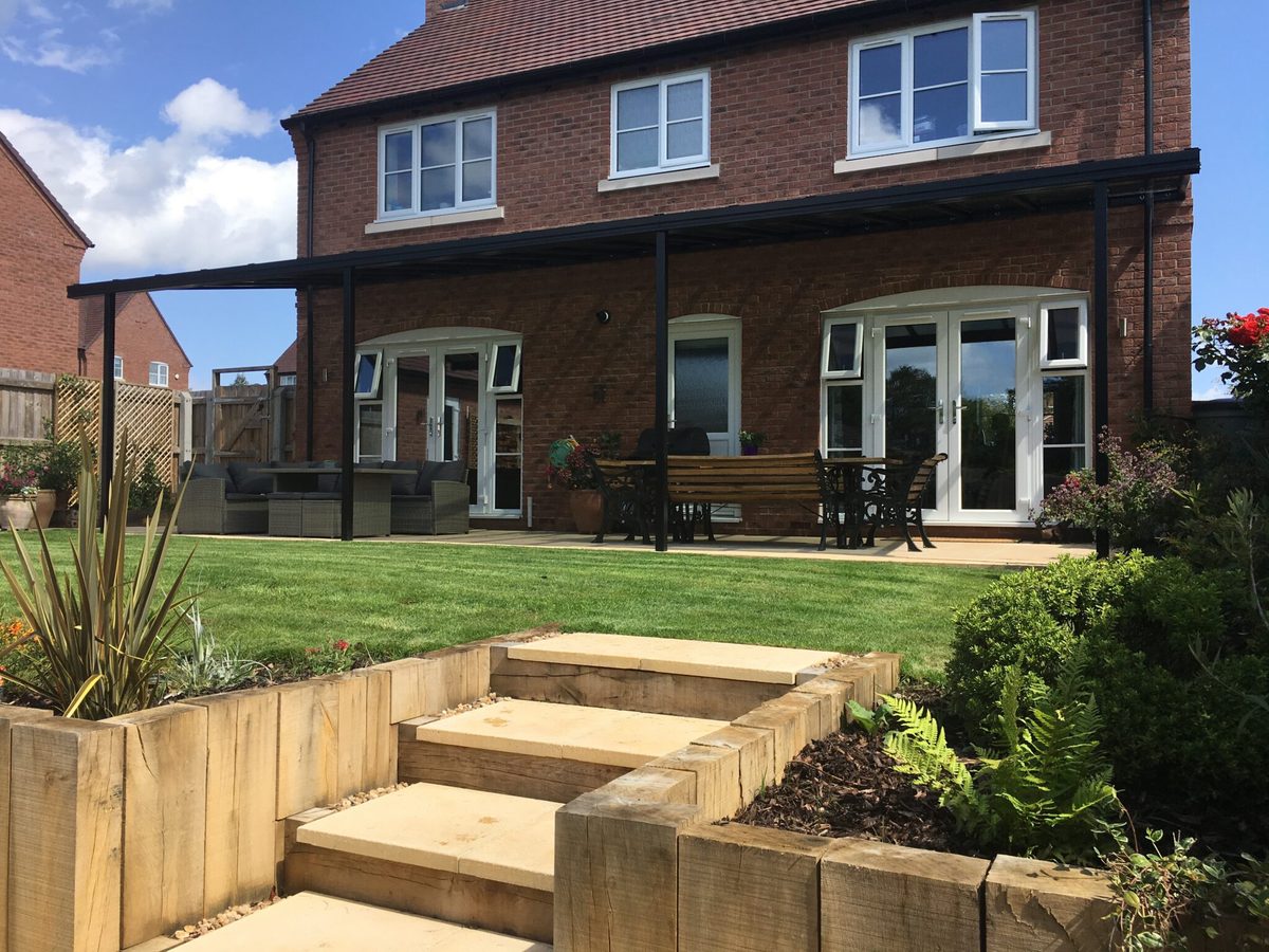 Large aluminium veranda across the rear of a home